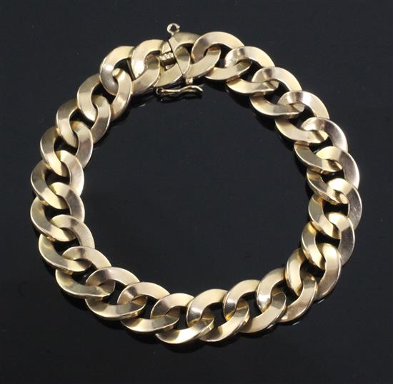 An 18ct gold flat curb link bracelet, 46.3 grams.
